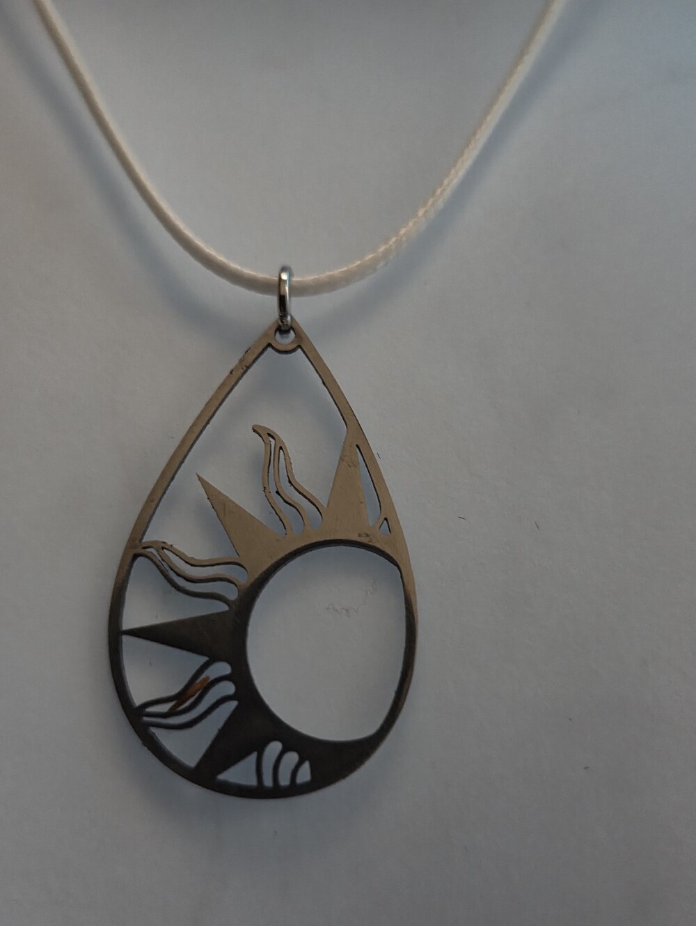 Silver Tone Sunburst Teardrop Pendant Necklace - White Cord